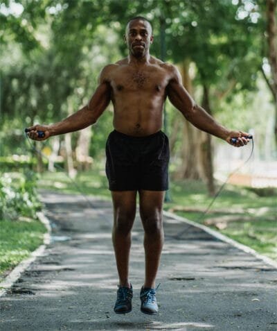 Fitness enthusiast using jump rope, a high-intensity cardio exercise that boosts agility and coordination