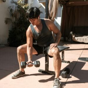 Beginner performing dumbbell squats with proper form