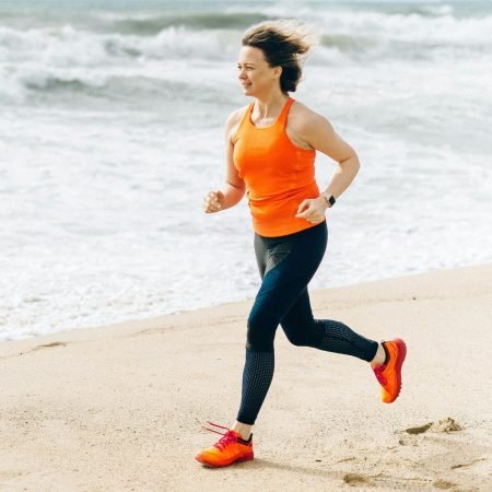 Person jogging at the sea, a simple yet effective cardio exercise for improving cardiovascular fitness
